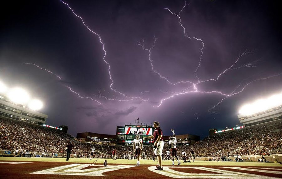 Lightning at Football Game- Mark Wallheiser/AP